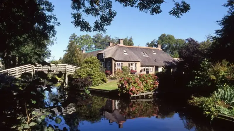 A house and a bridge on a canal in Giethoorn, Netherlands