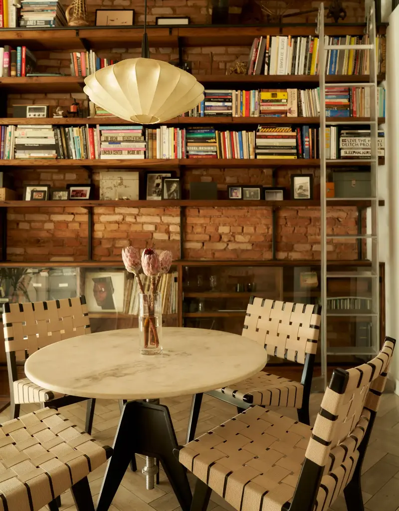 The vintage resin pendant softly sets the room aglow in this open dining room.Seth Caplan. Design: New Operations Workshop. Styling: Logan Sommers