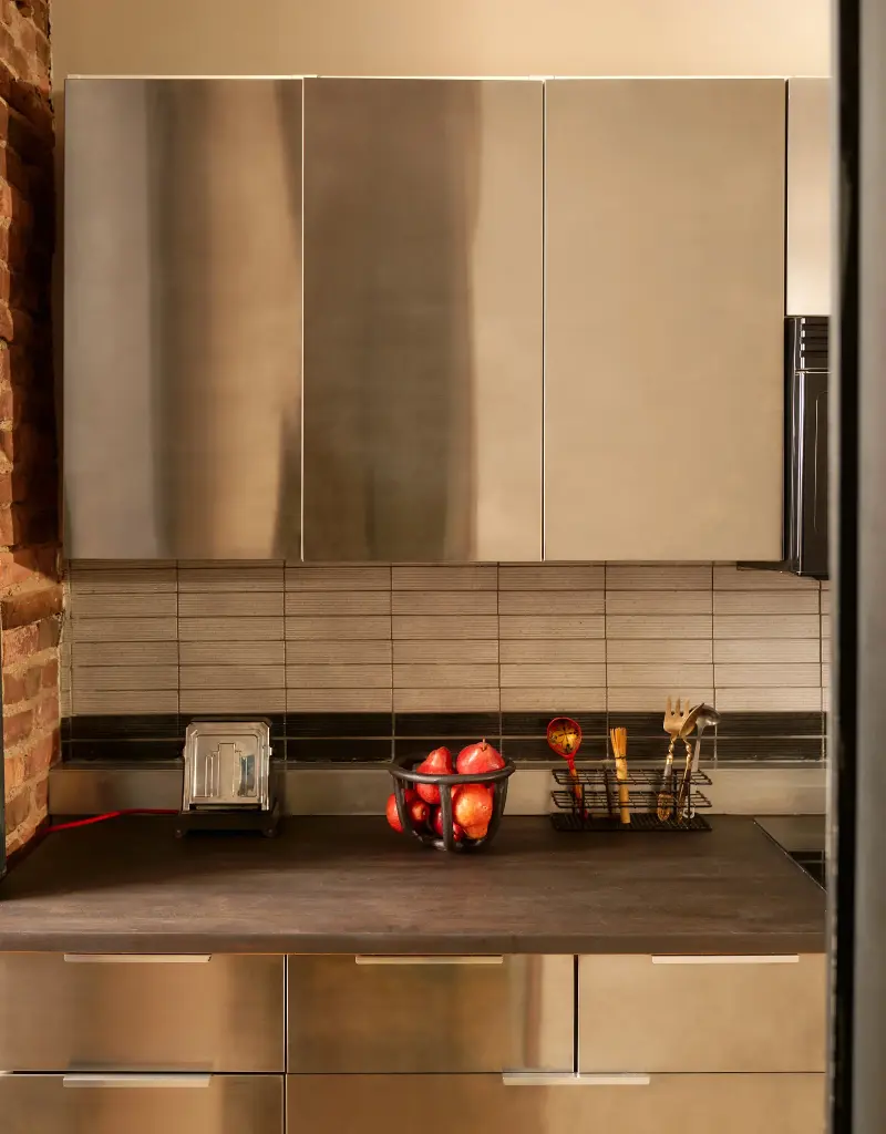I didn't know I needed industrial-style stainless steel kitchen cabinets until now.Seth Caplan. Design: New Operations Workshop. Styling: Logan Sommers