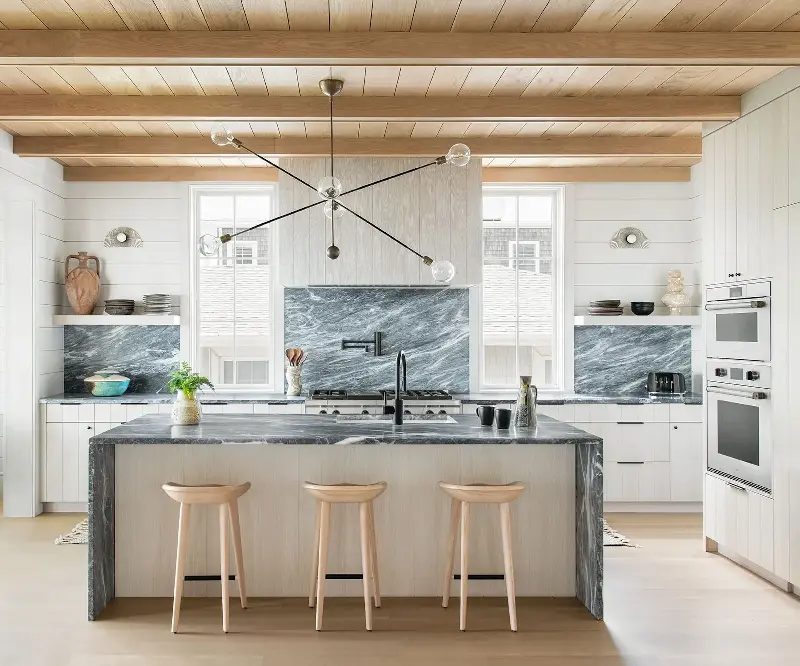 Vertical grooves give beadboard cabinets subtle texture and traditional charm. (Image credit: Katie Charlotte/Cortney Bishop Design)