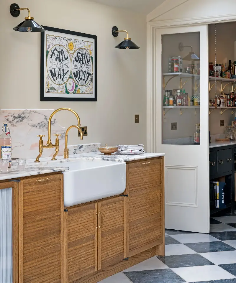 Natural wood cabinets work effortlessly with neutral surfaces, creating a warm, enduring palette. (Image credit: deVOL  / Leanne Kilroy of Good Bones)