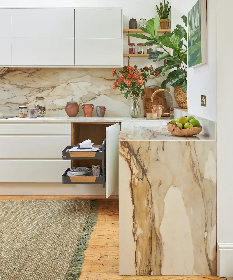 Pull-out corner storage brings hard-to-reach items into full view, making every inch of space work harder. (Image credit: Ryan Wicks/ John Lewis of Hungerford)