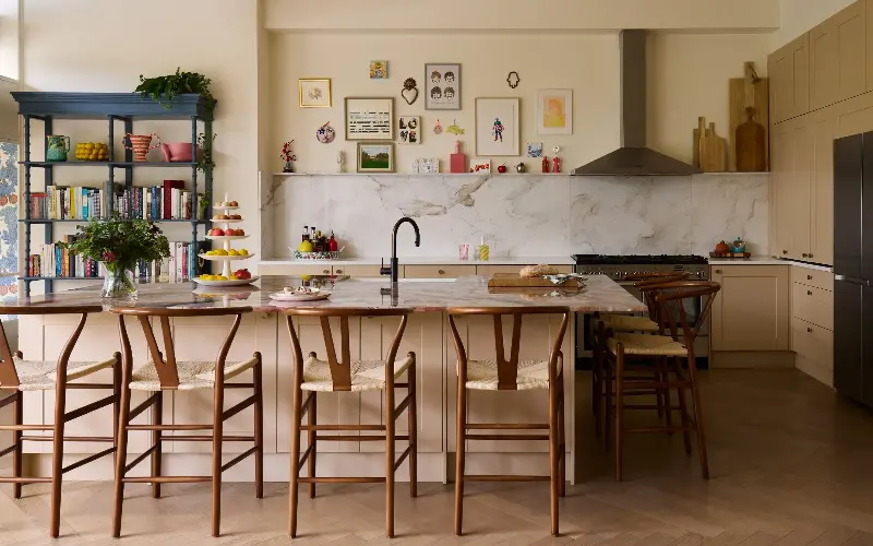 The kitchen island top was replaced with a piece of Rosso Orobico marble with a large overhang - Boz Gagovski