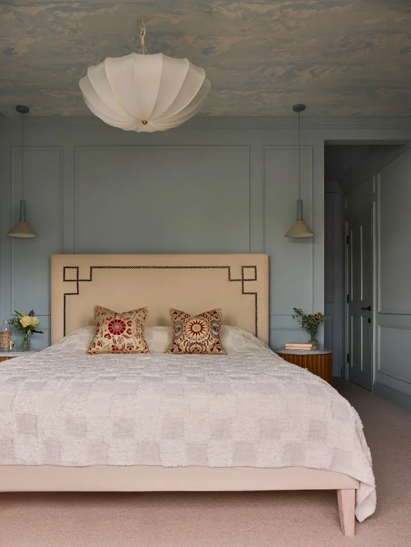 The main bedroom is painted in Aerial Tint, a light powdery blue by Edward Bulmer - Boz Gagovski