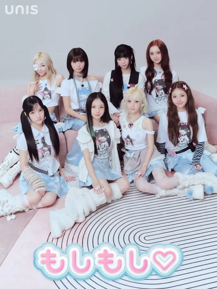 UNIS dressed in fashionable outfits, sitting together on a pink couch. They have varying hairstyles and accessories, creating a cute and playful aesthetic. The background features a spiral patterned rug, and the text 'もしもし♡' is displayed in a whimsical style.