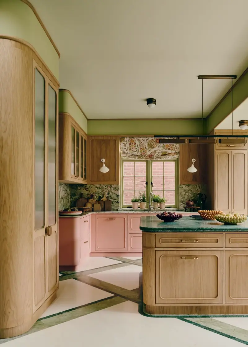 Green stone and olive detailing cut through the pink, keeping this palette deliciously offbeat. (Image credit: Michael Sinclair. Design: Maddux Creative)