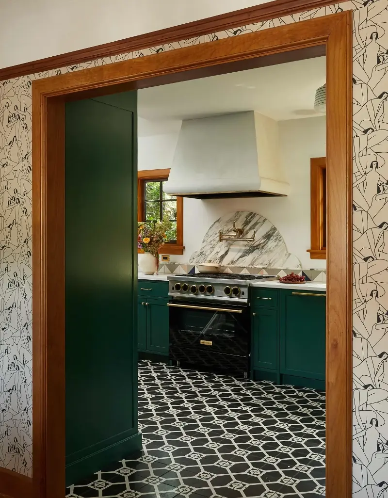 Deep green cabinetry gets a graphic kick from black-and-white flooring. (Image credit: Sally Painter. Design: Bright Designlab / Right Angle Construction)