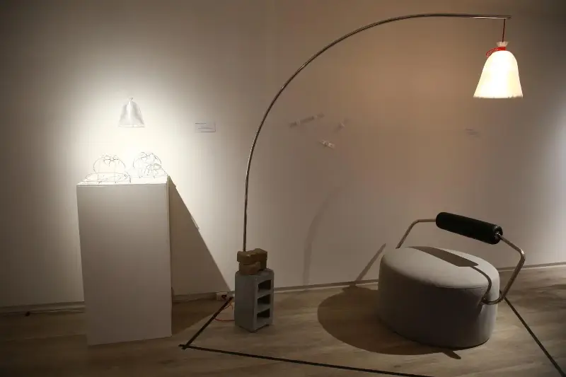 Curry Bag Lamp complements a chair inspired by a cement mixer.