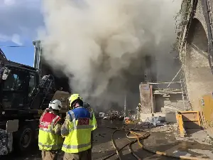 Brixton fire: Firefighters battle through night to contain huge blaze at waste facility